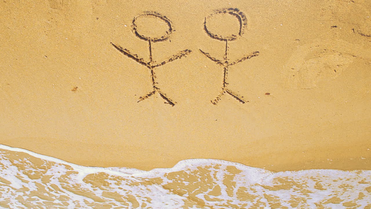 The drawing of tourists on the beach. Shooting on the beach