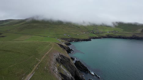 low dramatic clouds dunmore head on dingle peninsula ireland drone aerial view