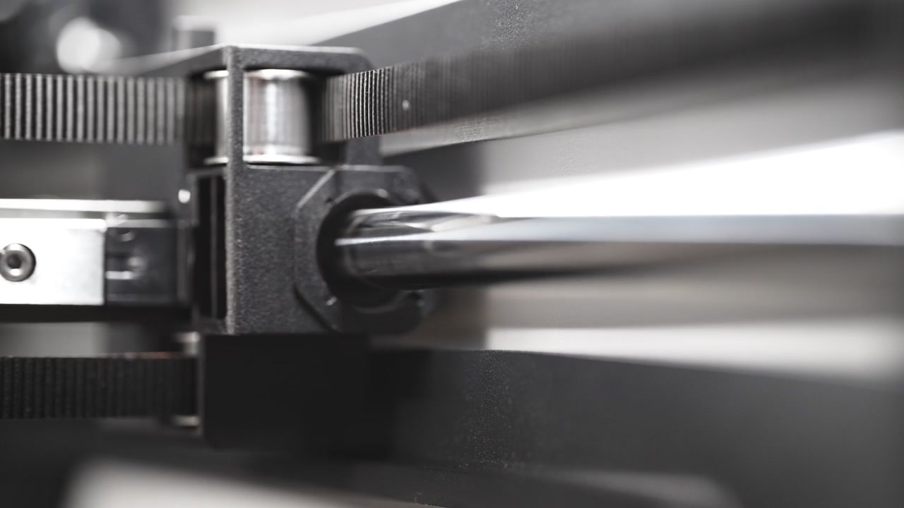 3D printer timing belt moving inner carriage along a polished metal rod