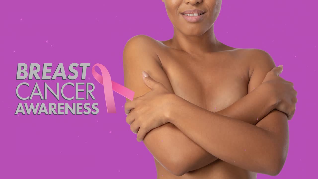 Animation of breast cancer awarness text and pink ribbon with mixed race woman