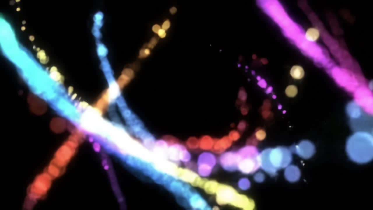 Vibrant Flow of Light Particles: A Mesmerizing Dance of Colorful Streams and Bokeh Effects Captivating the Imagination in a Darkened Background