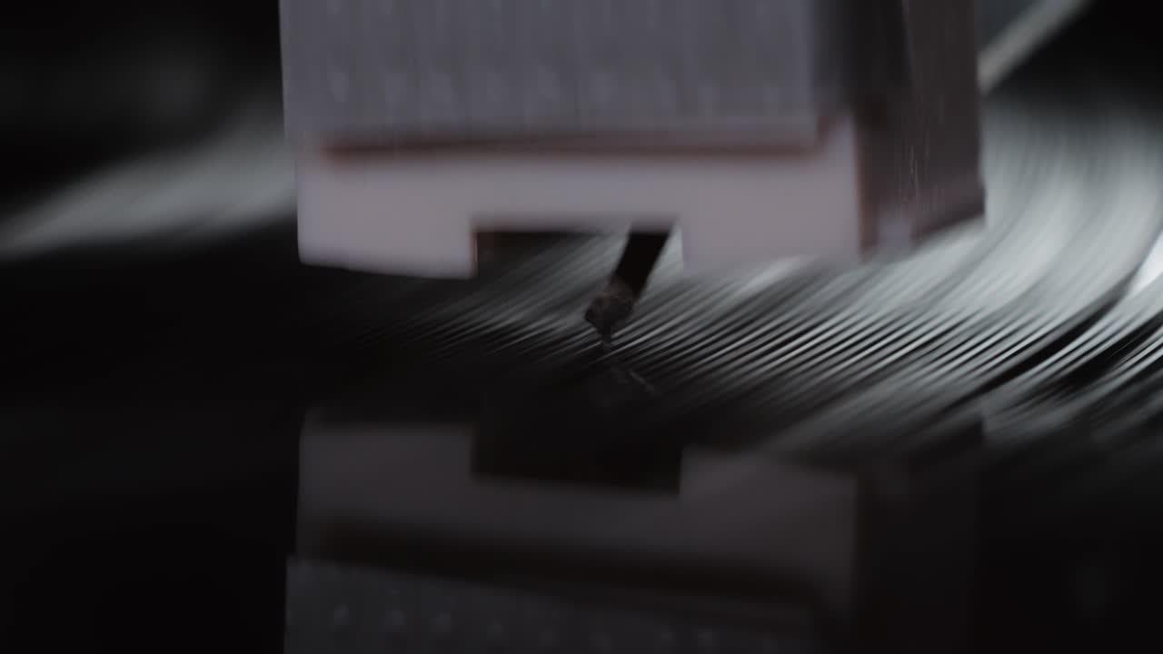 Retro Vinyl record player playing music, close-up macro shot of vintage LP disc old phonograph spinning. Retro music player.