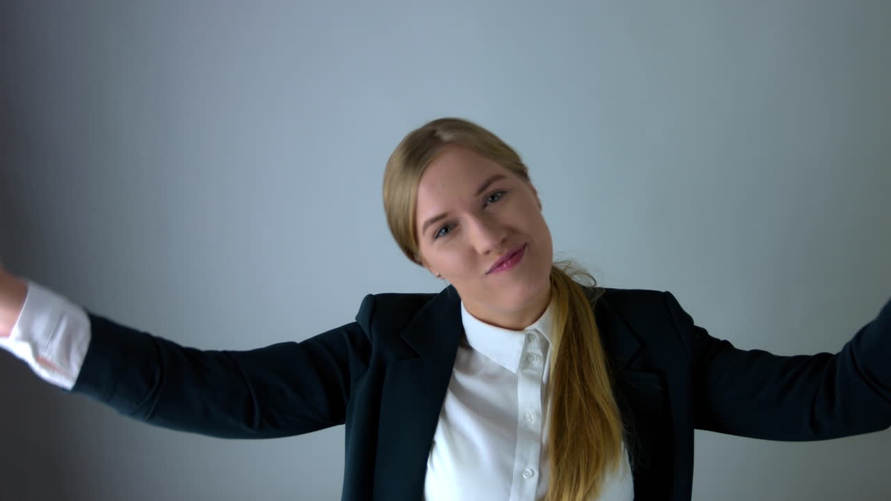 Happy business woman laughs and dances with happiness