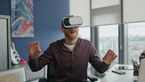 Surprised-man-enjoying-vr-in-hipster-office-closeup.-Gamer-exploring-metaverse