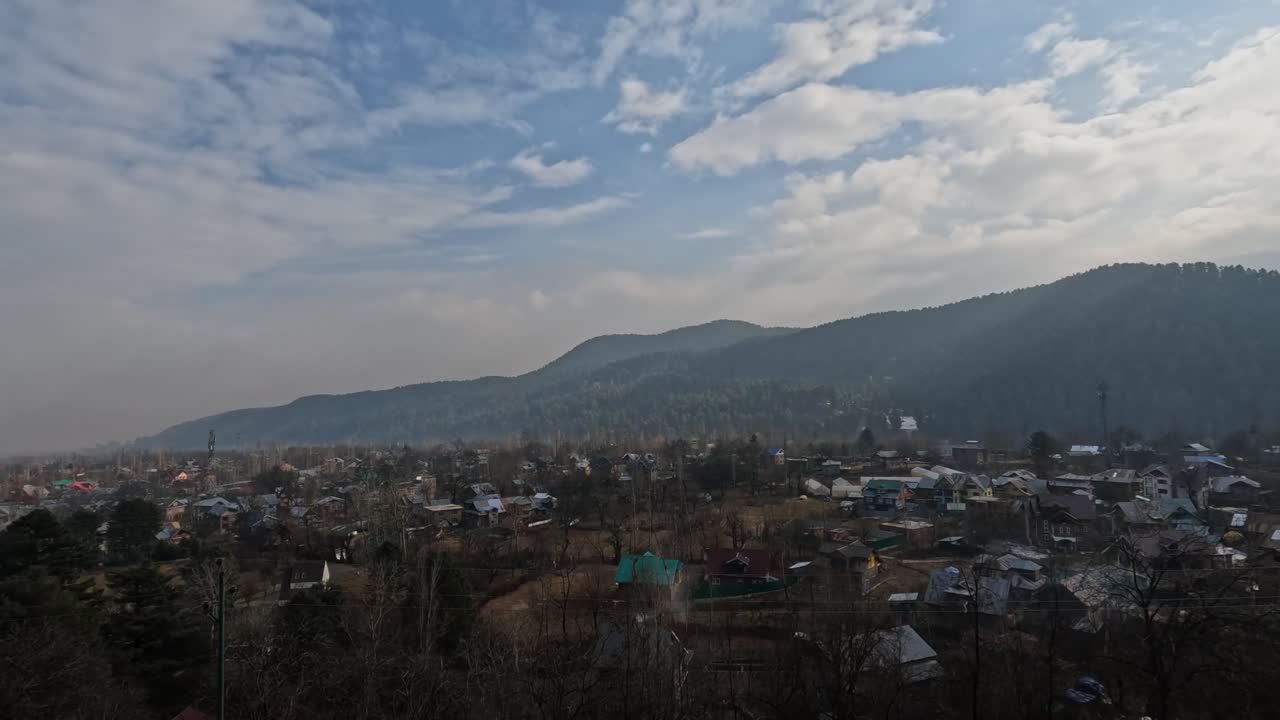 Aerial View of small Town with Mountains and Clouds at srinagar. day time, trucking shot, 4k