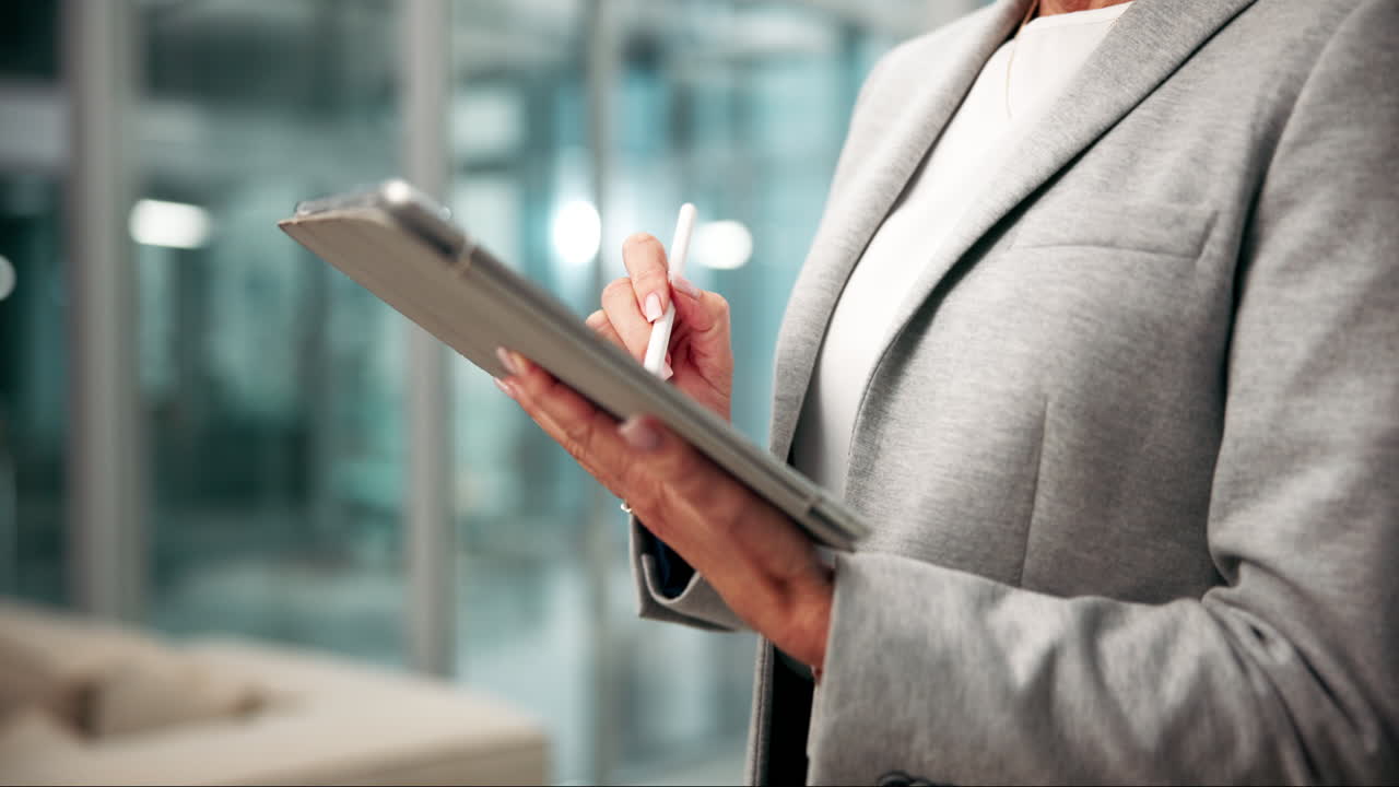 Professional woman using a tablet in a modern office