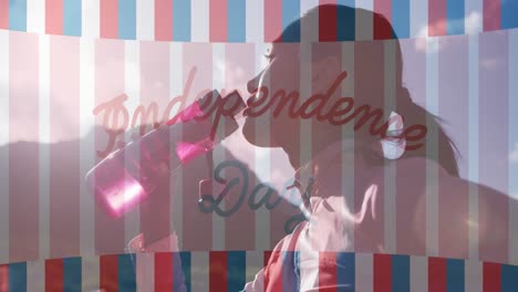 Animation-of-independence-day-text-over-biracial-woman-drinking-water-and-hiking