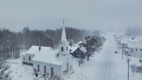 heavy snowfall surrounds monson community church