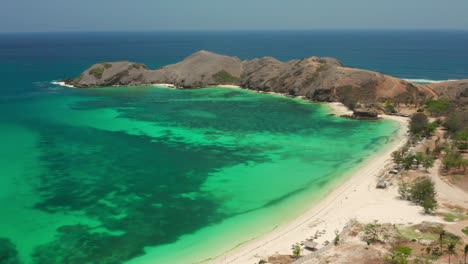 the white sand beach of tanjung aan in lombok, indonesia during a sunny day