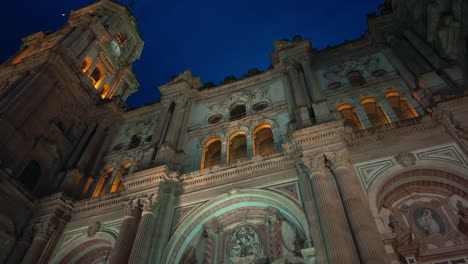 facade of the malaga cathedral at night in andalusia, southern spain