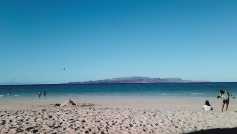 Tecolote-beach-people-ralaxing,-view-Espiritu-santo-Island,-baja-california-sur-15-january-2022