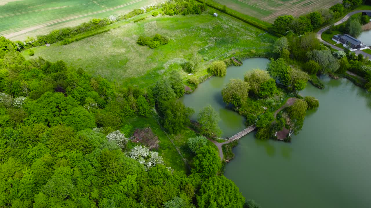 Aerial view of natural landscape with a river flowing among the village