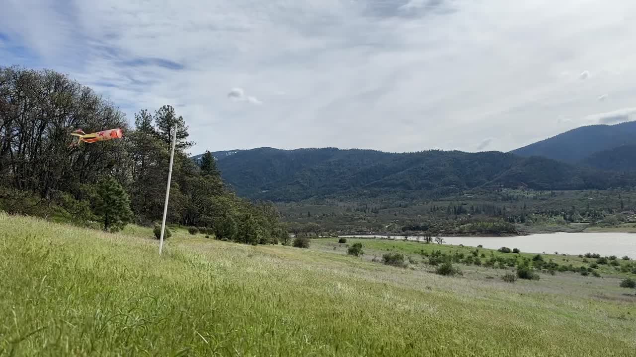 Kite blows in the wind next to Emigrant Lake