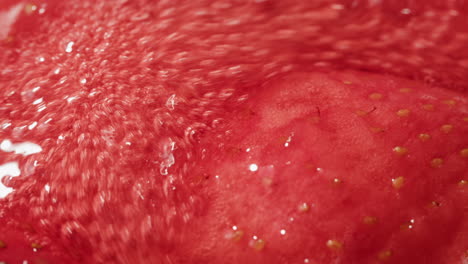 close-up of a strawberry with water droplets