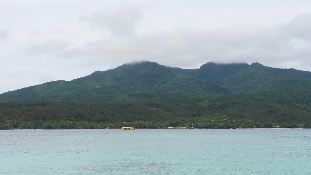 Serene Tropical Island Landscape with Mountains and Ocean