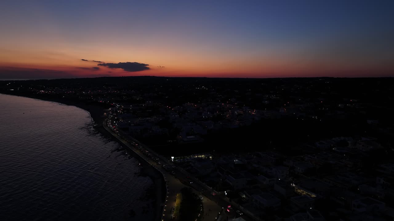 Breathtaking 4K aerial sunset over the sea, with vibrant colors painting the sky and water