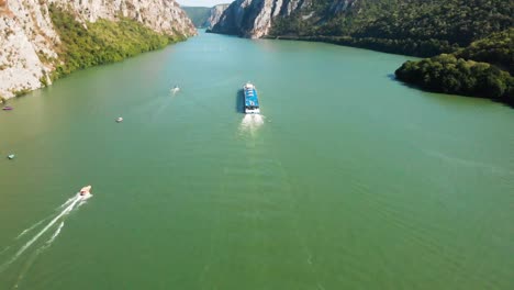 summer aerial drone shot of danube gorge in serbia, with impressive rock formation and a river valley