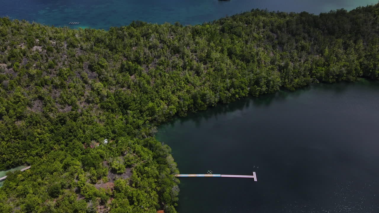 Wooden Jetty By The Shores Of Matano Lake In South Sulawesi, Indonesia. Aerial Drone Shot