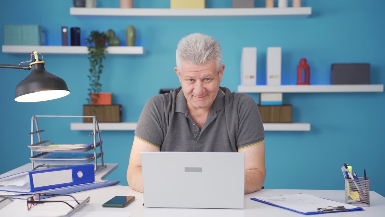Ambitious and determined portrait of home office worker man.