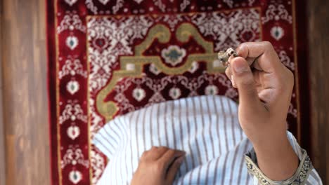 muslim man hand praying during ramadan, close up