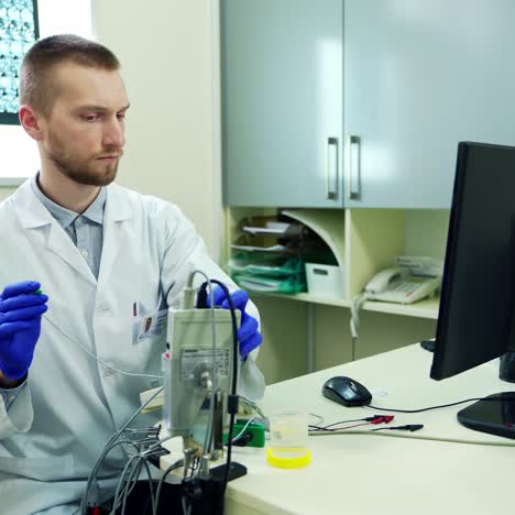 male scientists working on computer. doctor in lab in front of computer in hospital office