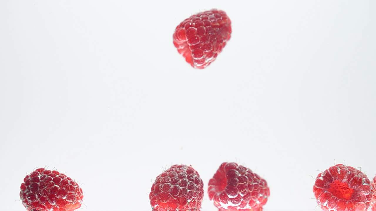 Raspberry on a white background. Shooting on a white background
