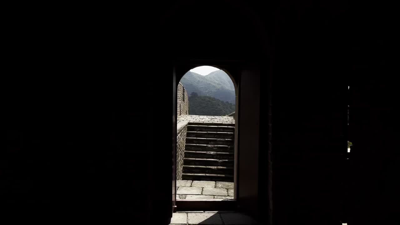 Man Walking Through Archway on Great Wall of China