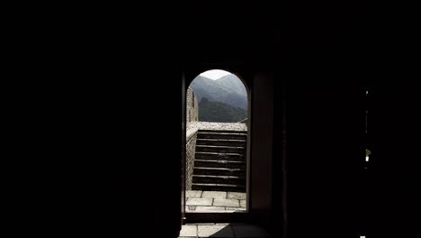 man walking through archway on great wall of china