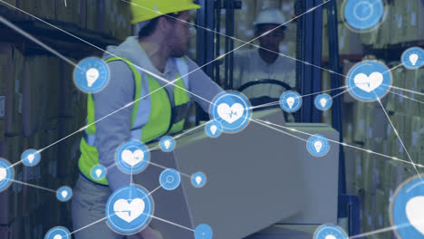 Animation-of-network-of-icons-over-caucasian-male-worker-stacking-boxes-on-a-forlift-at-warehouse