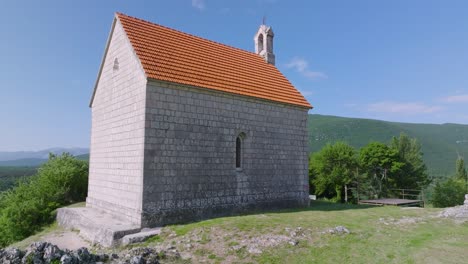 Drone-shot-revealing-Lady-Mary-of-Sinj-chapel-above-Town-of-Sinj-in-Dalmatia-hinterland,-Southern-Croatia,-Europe