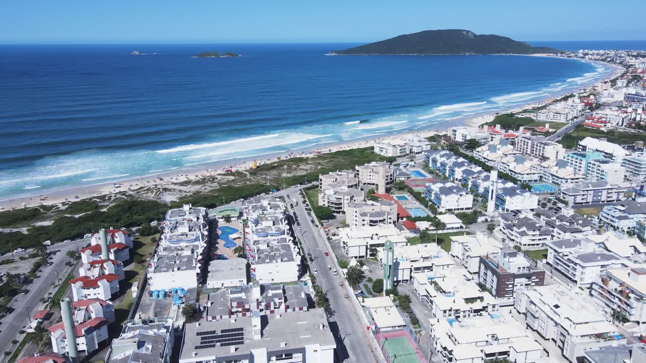 Panoramic aerial view of Ingleses beach in Florianópolis, Santa Catarina, an urban complex on the coast, city master plan, neighborhoods and real estate developments facing the sea