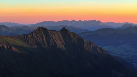 mountain landscape dynamic slow stable drone shot at sunset in alpine environment and sharp ridges