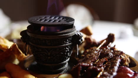 meats and foods circle on a hibachi grill