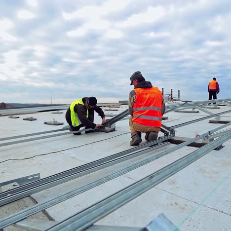 workers installing solar panels outdoors