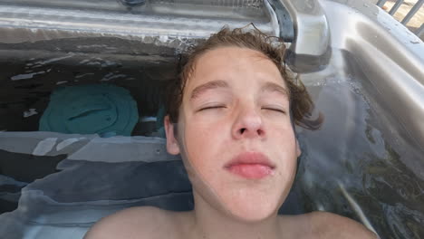 teenager enjoying warm outdoor bath