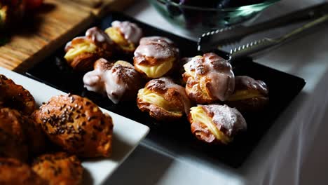 sweetened pastries with white vanilla glaze on indoor reception table