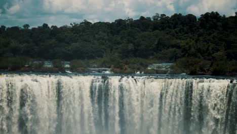 iguazu falls water flowing to the iguazu river in daytime