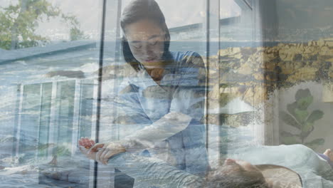 assisting patient, healthcare professional over serene ocean waves animation background