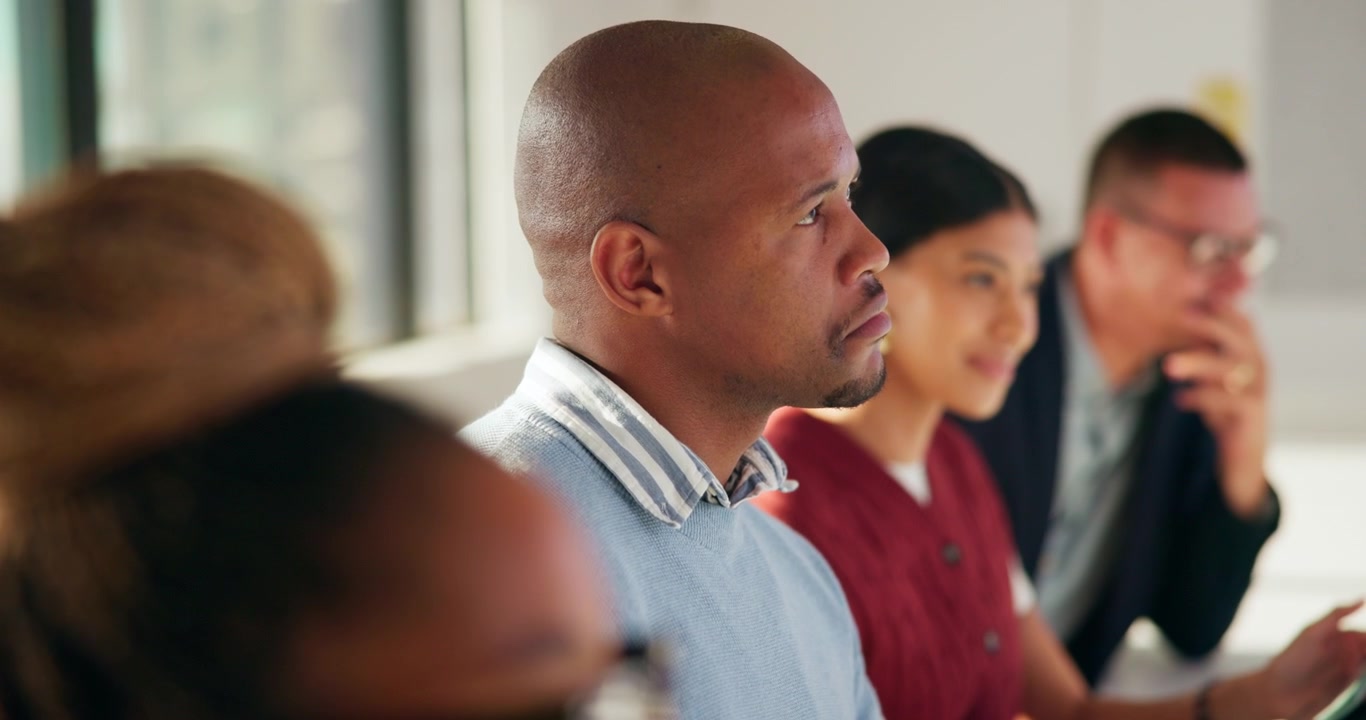 Diverse Group of Professionals Attending a Business Meeting