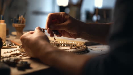 jeweler working on a necklace