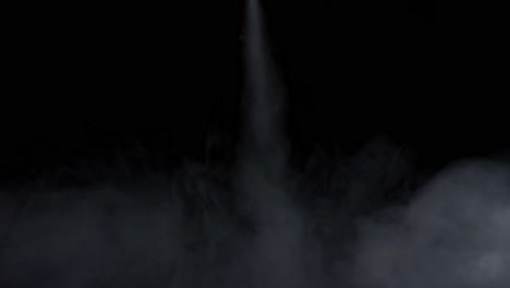 smoke spraying from the top to down on black background
