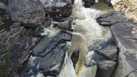 Sweeping-shot-of-a-dangerous-rocky-waterfall-in-jungle-of-Madagascar