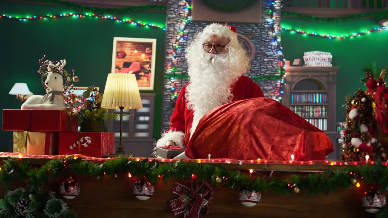 Santa Claus packing gifts for Christmas