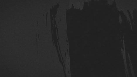 animation of black marks and scratches moving on dark grey background