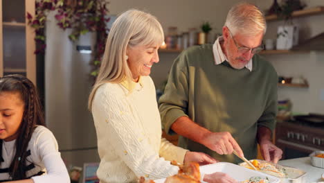 family cooking thanksgiving dinner together