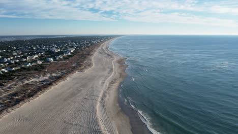 Wide drone shot of beach in the winter time, aerial footage