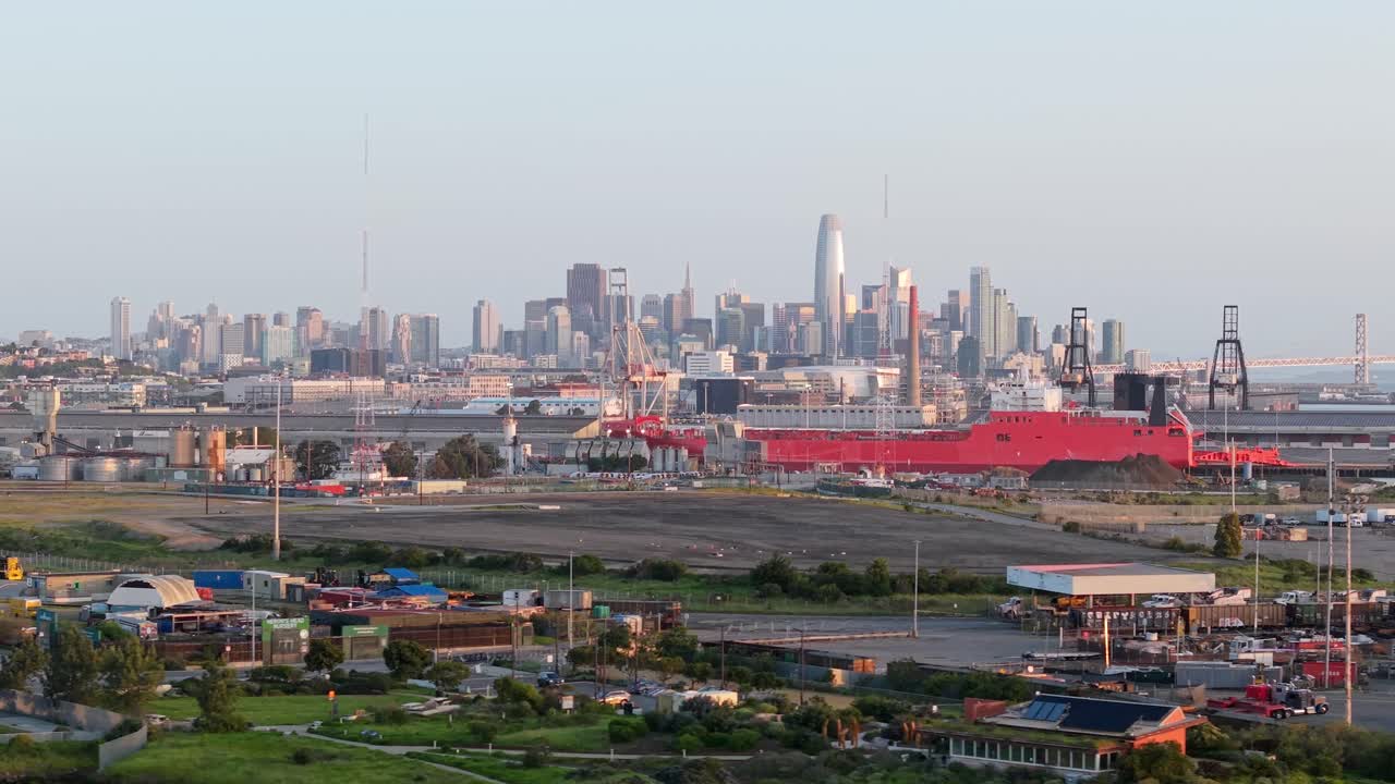 A panning view from a drone captures the industry and development surrounding Heron’s Head Park in San Francisco California.