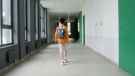 schoolboy walking through the corridor.