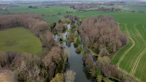 aerial view of ponds with a lot of nature and fields