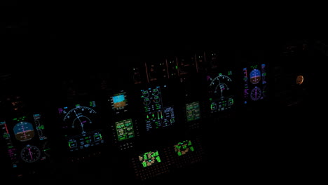 illuminated instruments and avionics of an aircraft flight deck in a pitch black cockpit